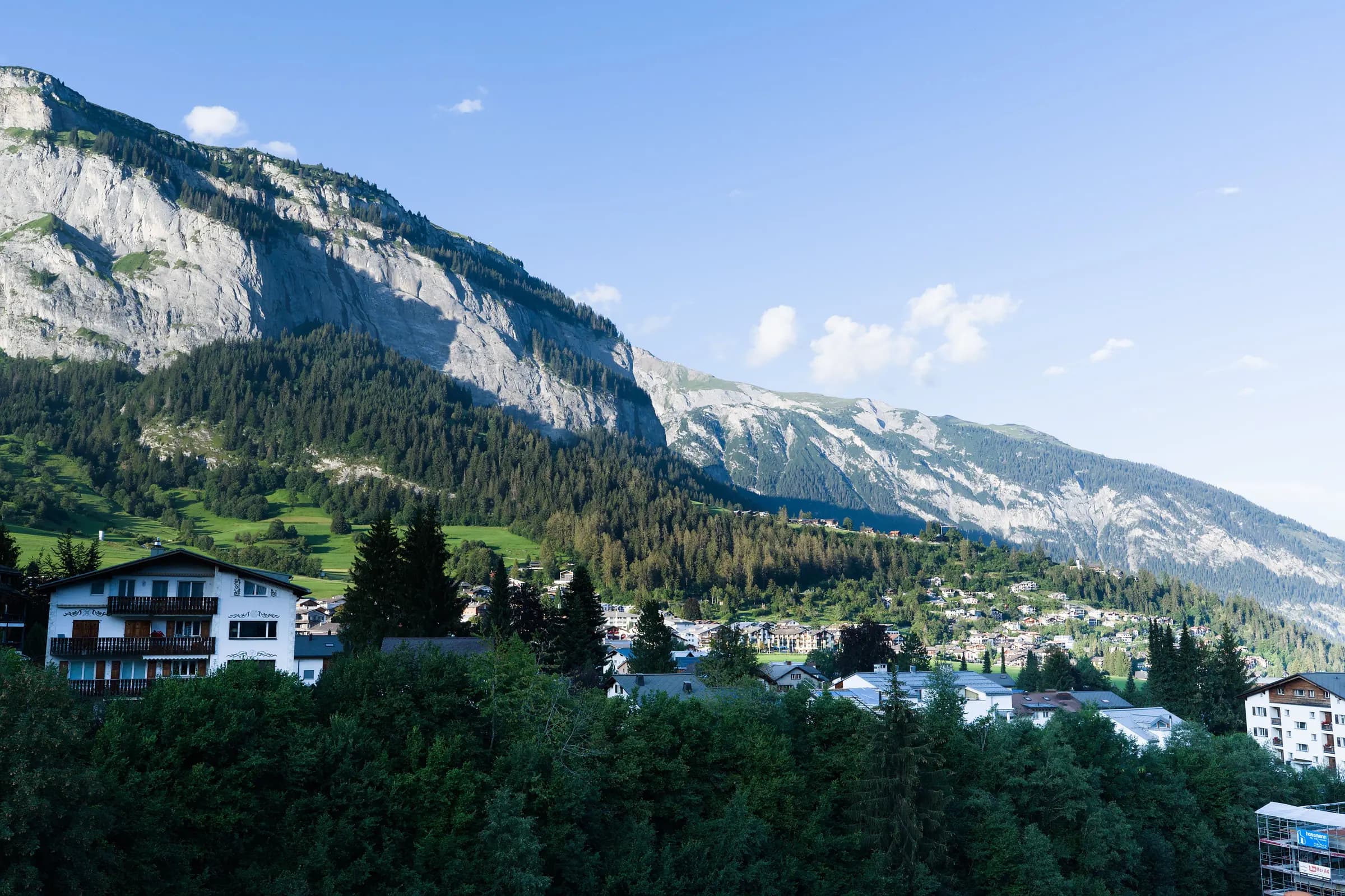 Breathtaking landscape of the Swiss Alps with charming alpine village in summer.
