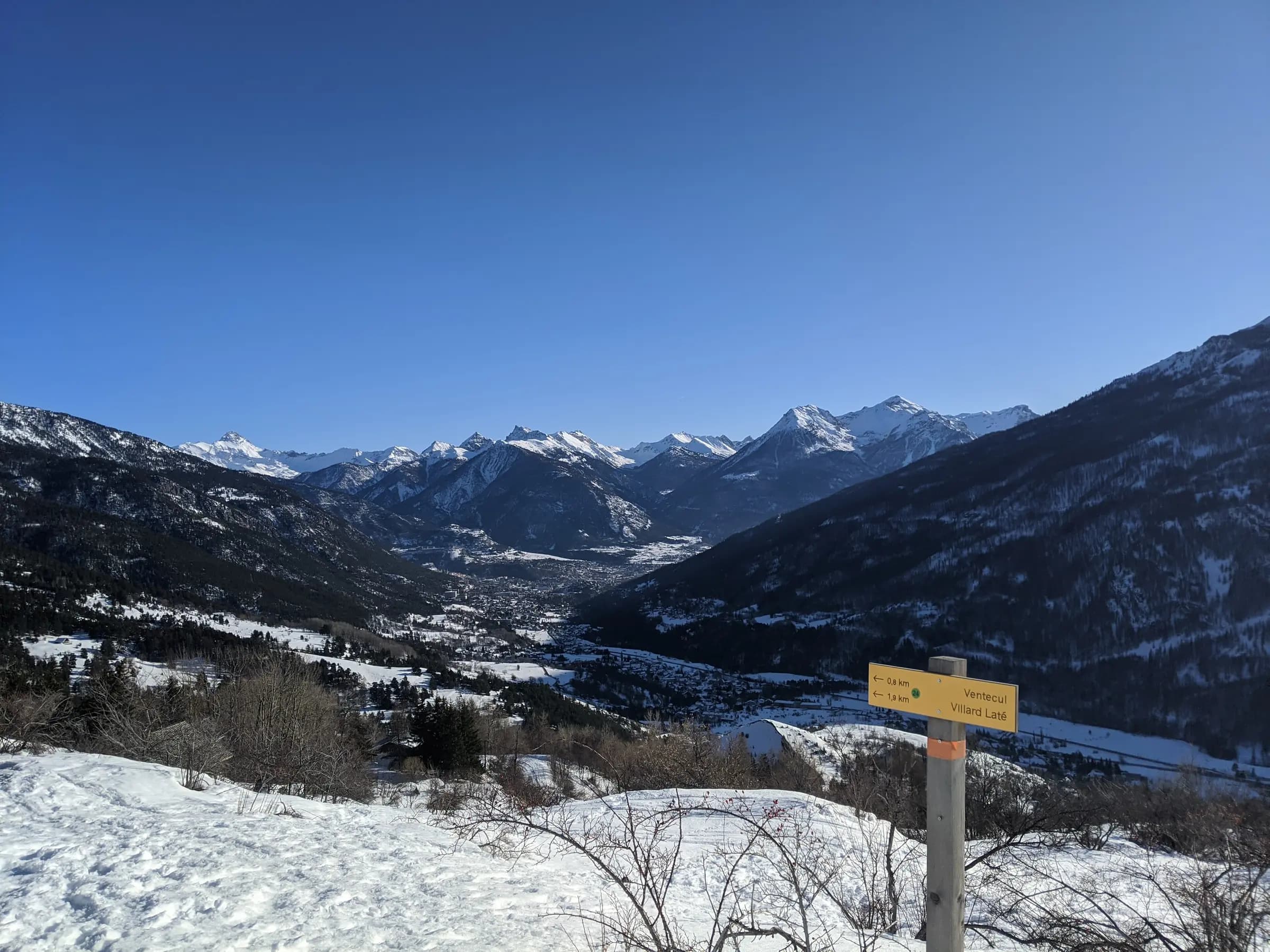 Picture overlooking the valley of Saint-Chaffrey and Briançon from high up on the Col du Granon in Winter