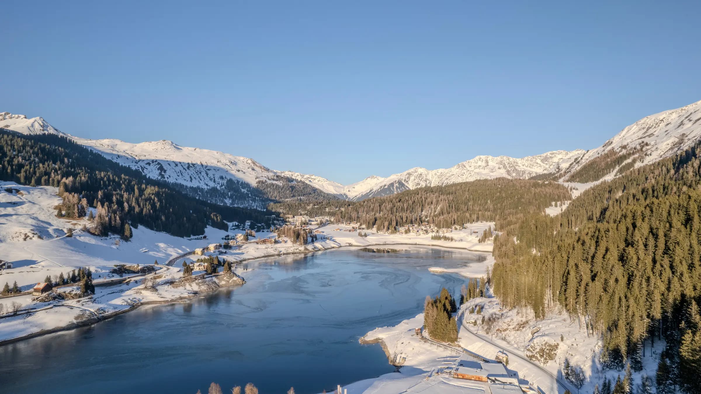 A beautiful winter view of a snow-covered alpine landscape in Davos, Switzerland.
