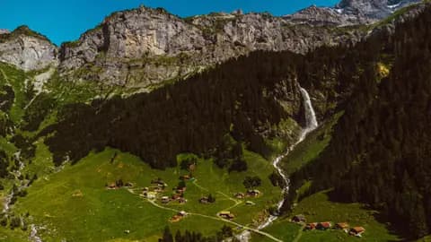 A picturesque Alpine village with a waterfall near Engelberg, Switzerland.