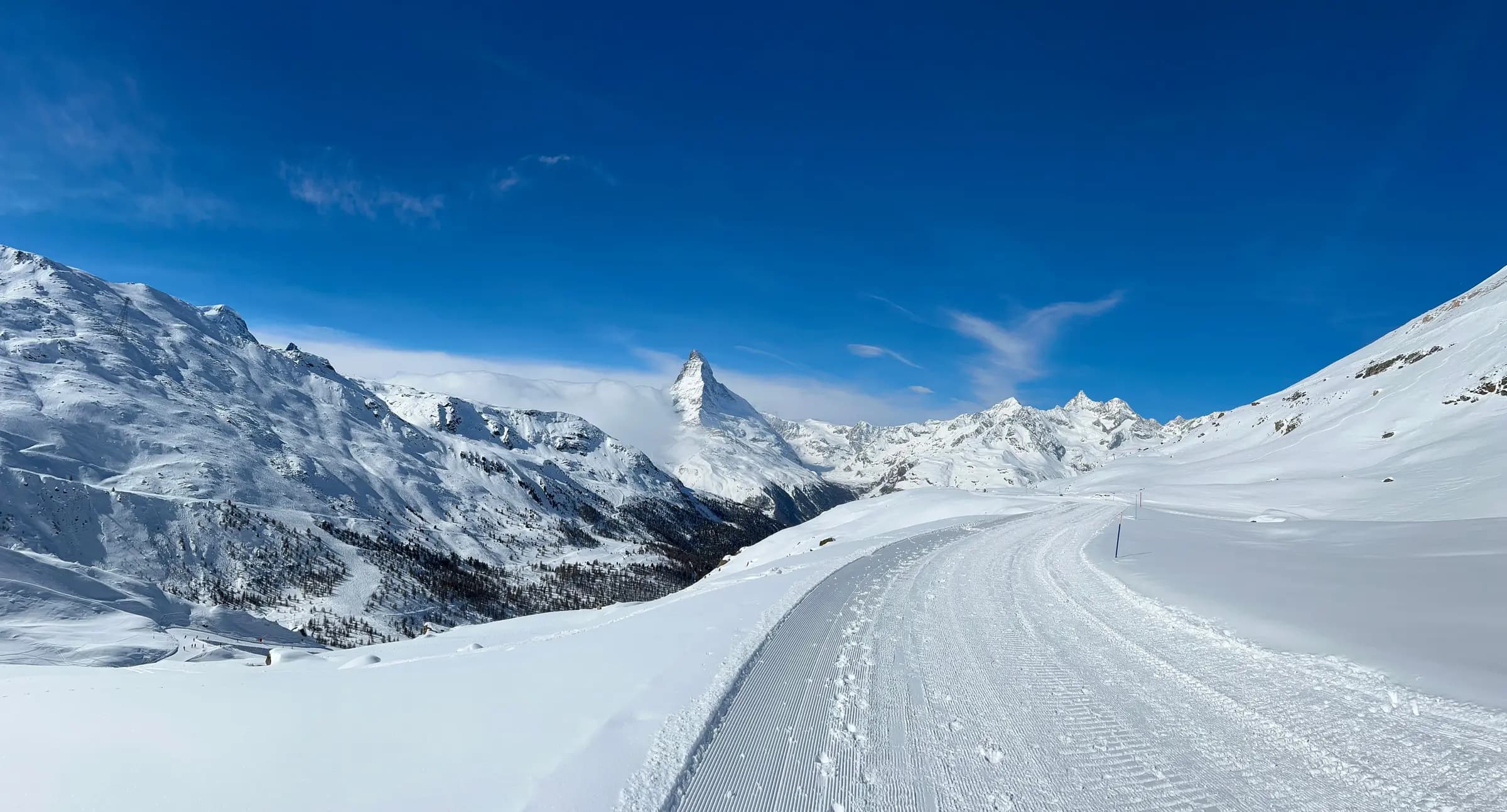 A breathtaking view of the Matterhorn amidst snowy mountains in Zermatt, Switzerland.