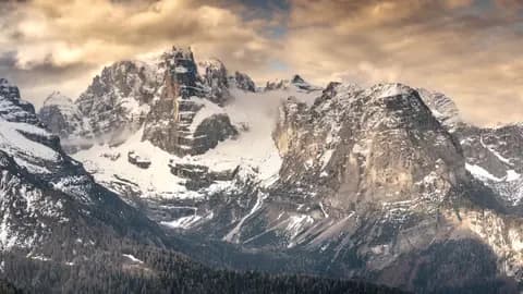 Stunning winter landscape of the Dolomites in Italy with snow-covered peaks.