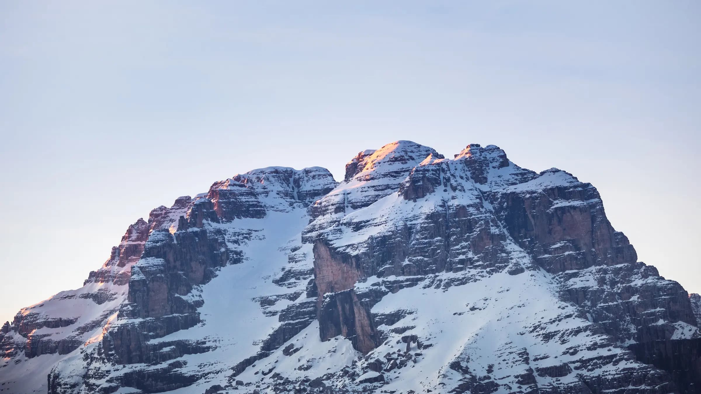 Majestic snow-covered mountain peaks in Madonna di Campiglio, Italy.