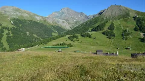 Breathtaking mountain landscape showcasing green valleys and clear blue skies, ideal for nature lovers.