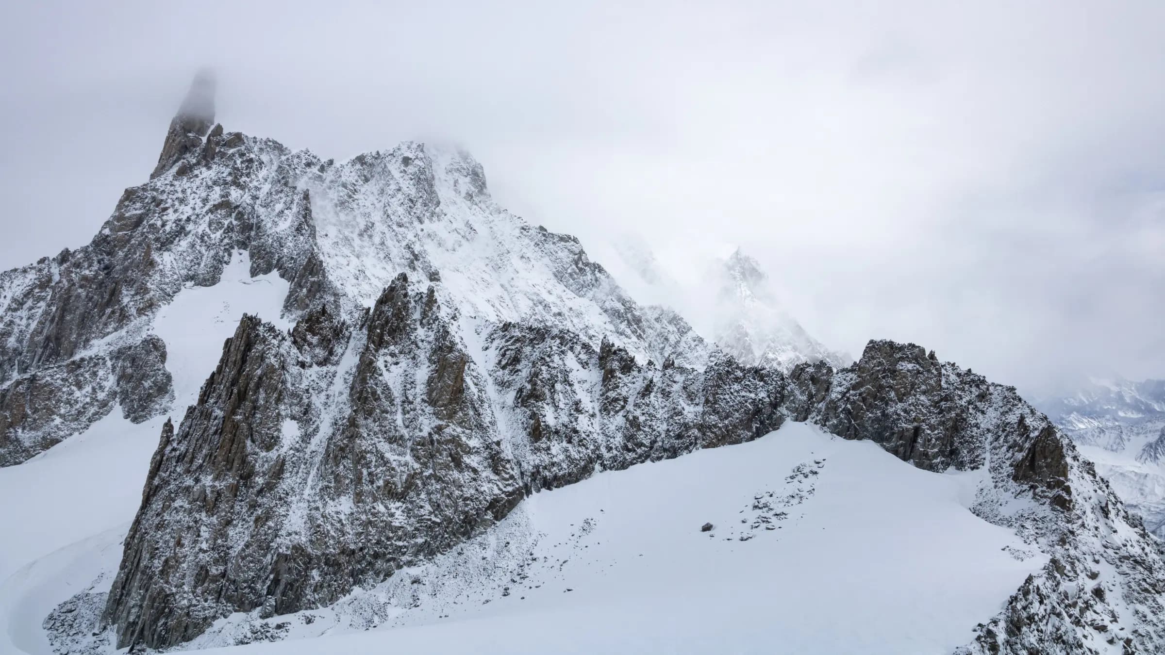 Stunning winter view of snow-covered peaks in Courmayeur, Italian Alps.