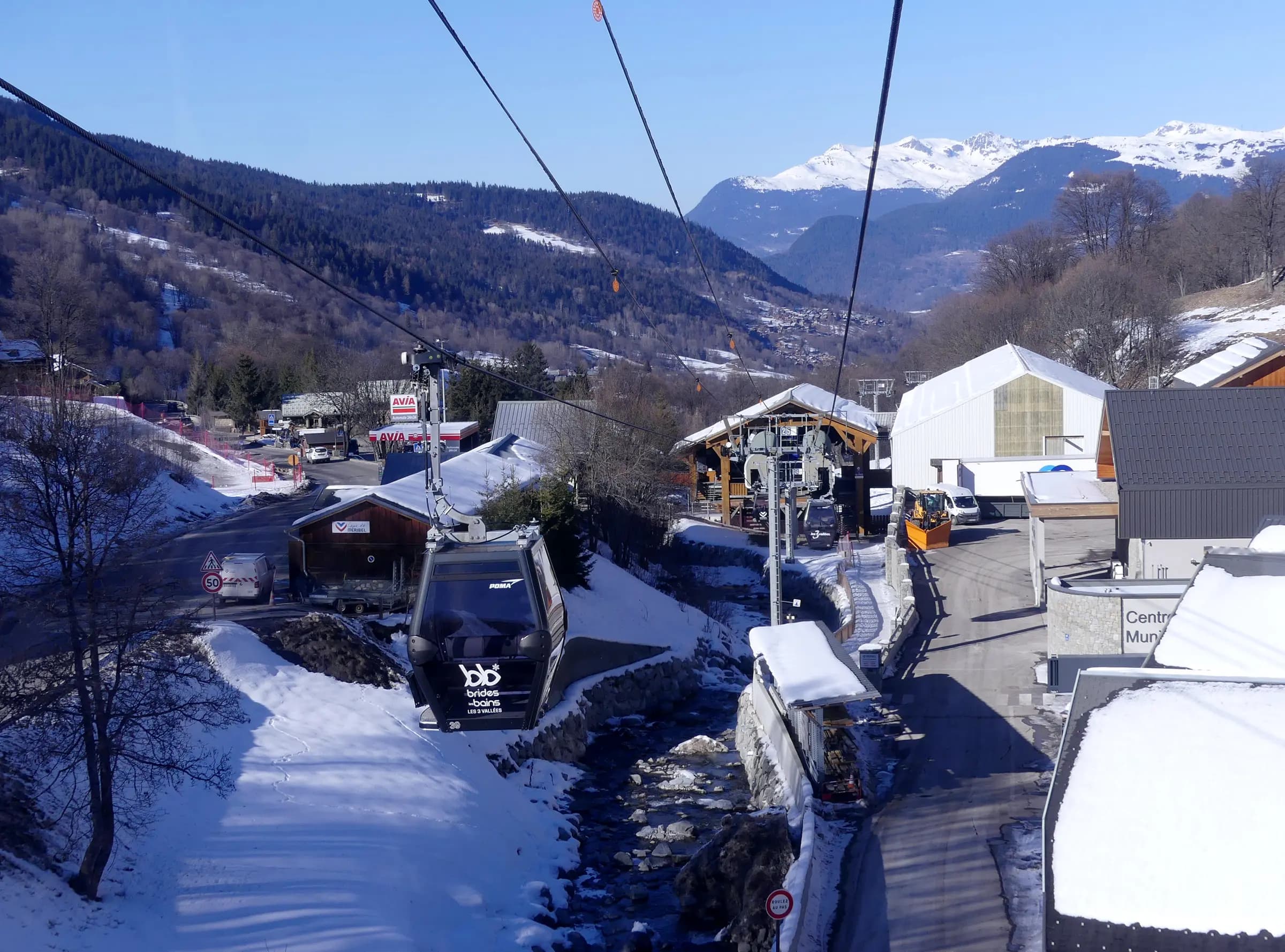 Sight, in winter from a gondola, of Olympe gondola lift near Le Raffort intermediate station, towards Brides-les-Bains village, in Savoie , France .