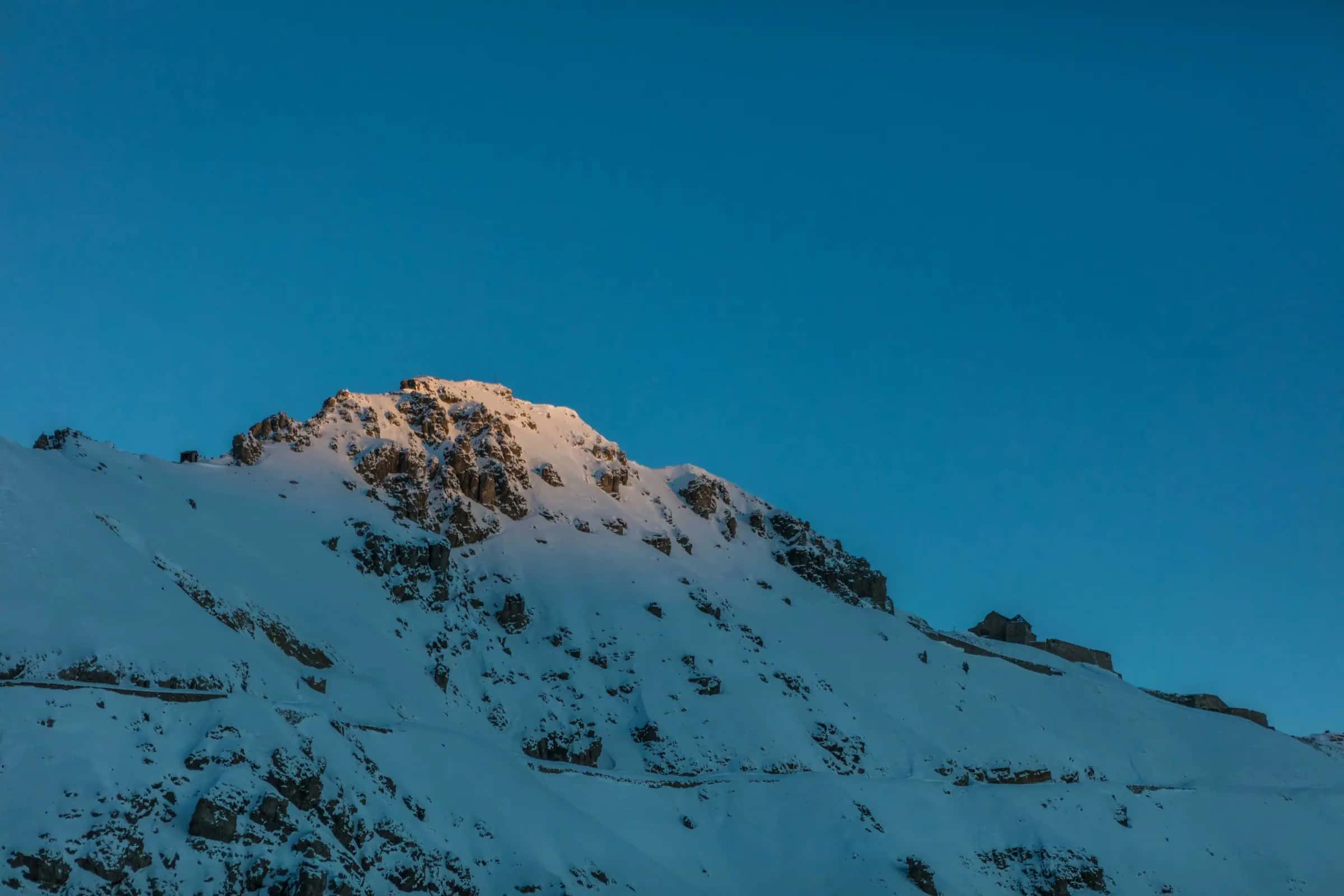 snow covered mountain under blue sky during daytime